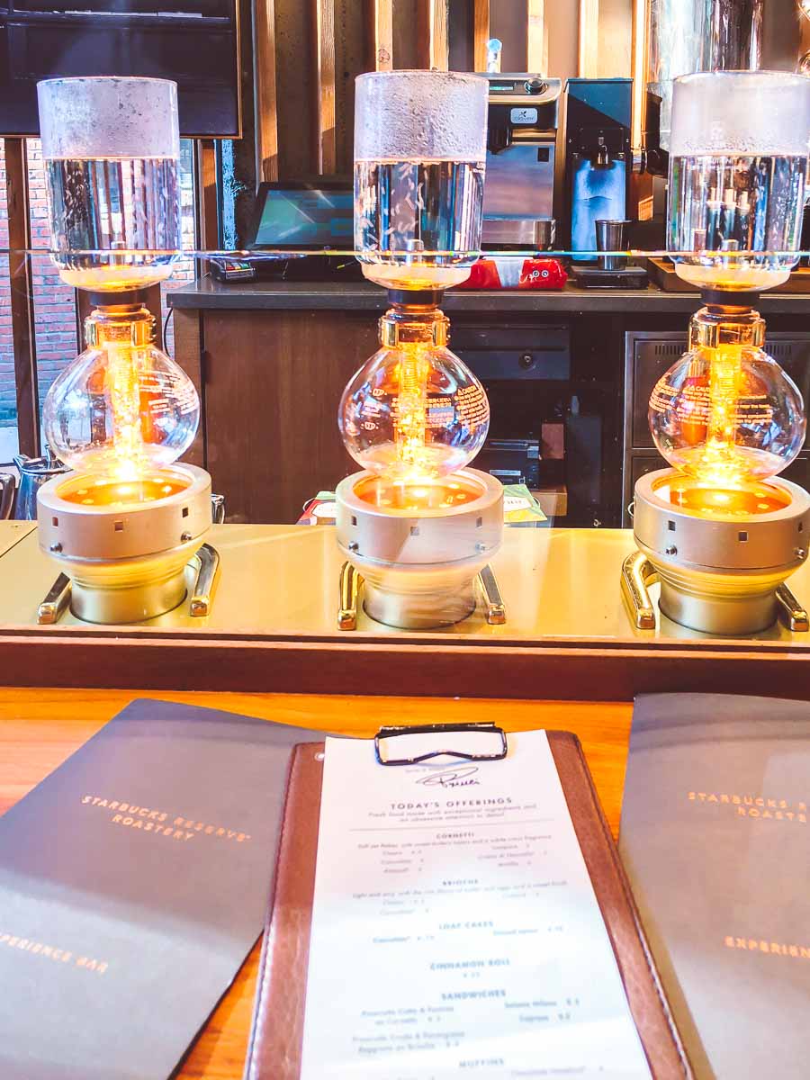 Three Starbucks siphon coffee machines brewing